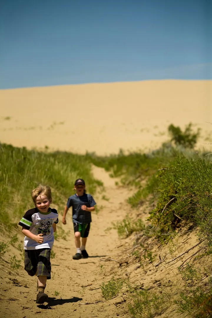 kids running through great sand hills